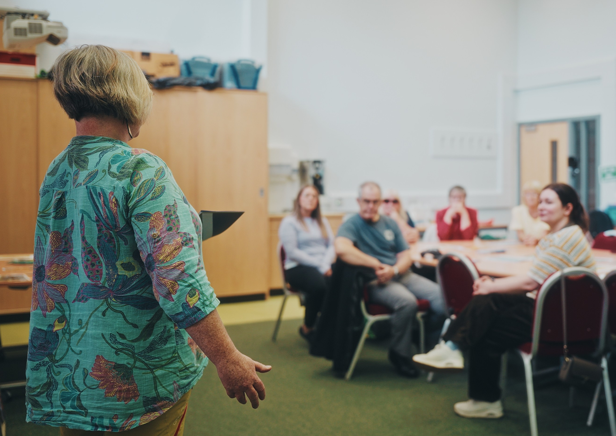 An image showing someone presenting to an audience.